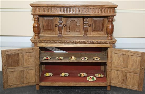 A Fergus Lane miniature Jacobean style oak court cupboard, court cupboard 10.25in.